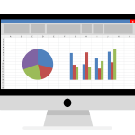 Creating a Chart in Excel and G-Sheets A computer monitor displays a spreadsheet with a pie chart and bar graphs.